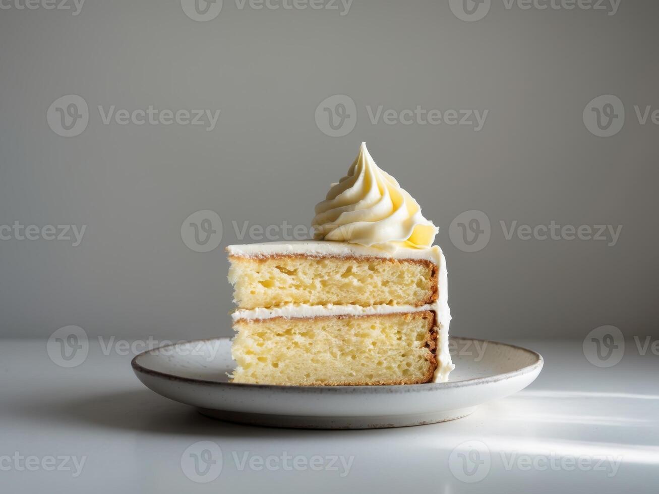 A slice of cake on a plate with a white background photo