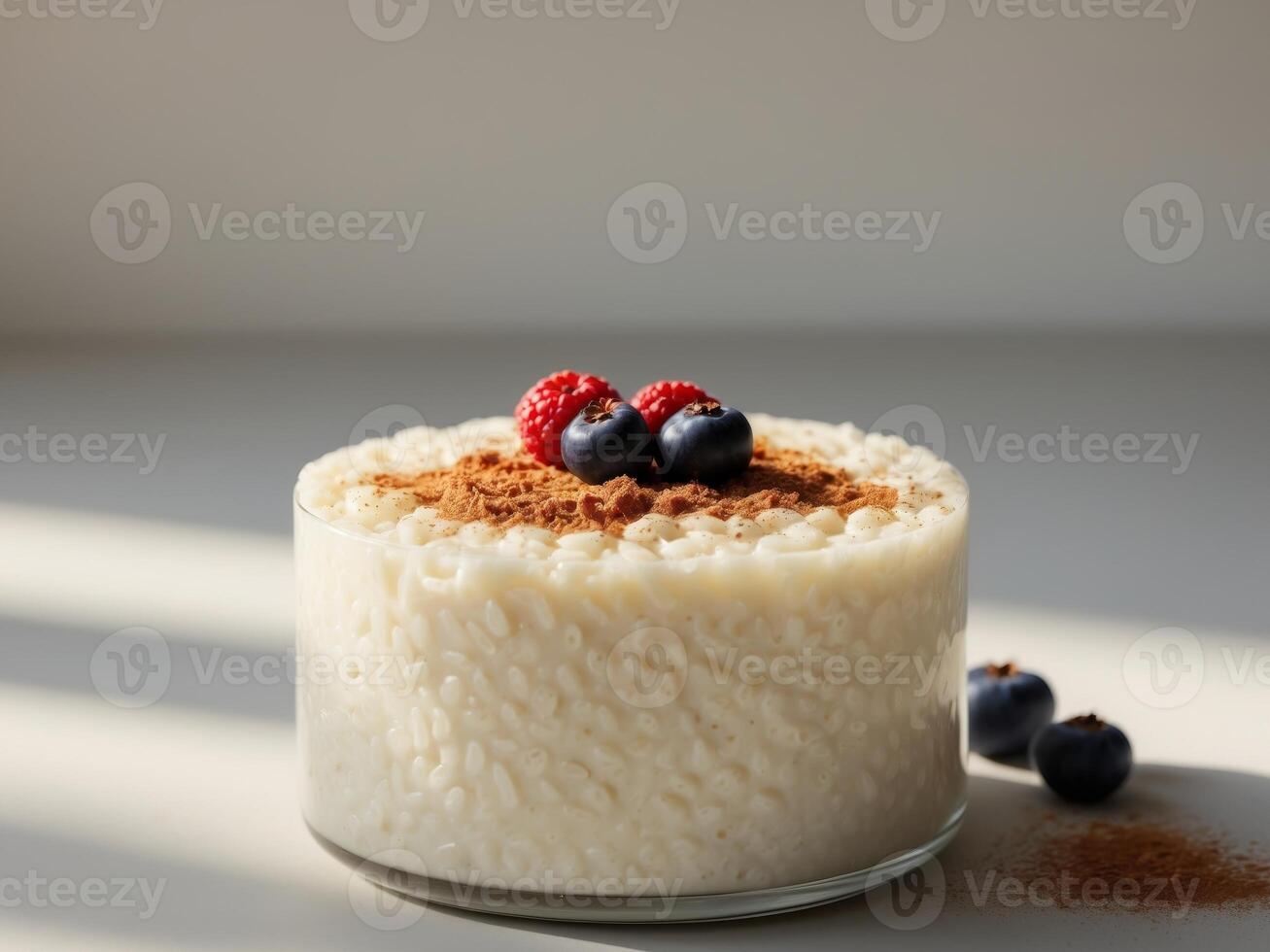 A dessert with rice and berries on top photo