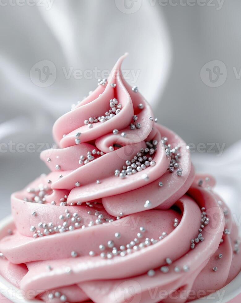 Closeup of Pink Frosting with Silver Sprinkles photo