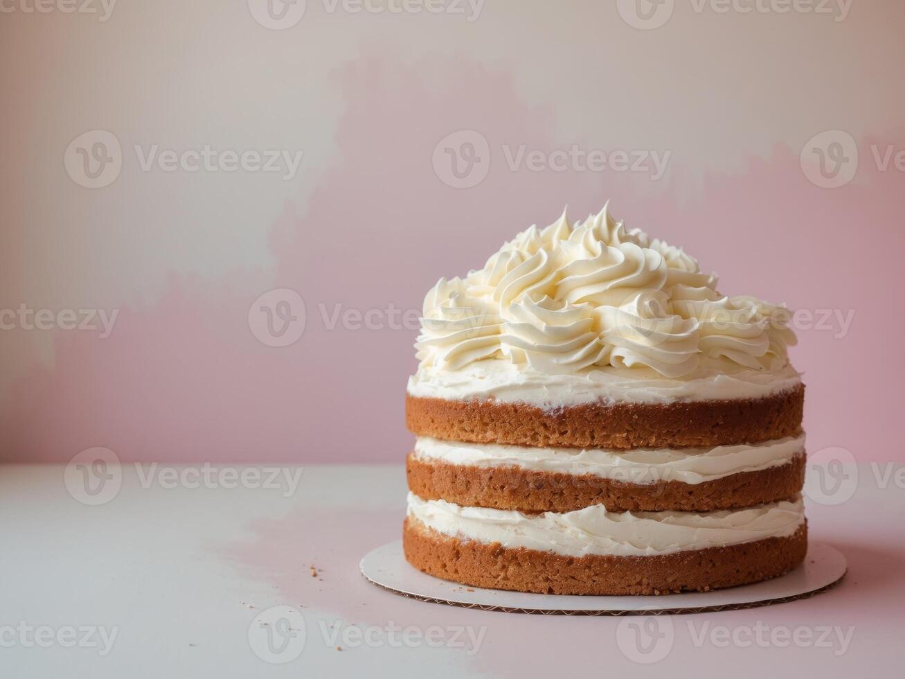 A cake with white frosting on top photo