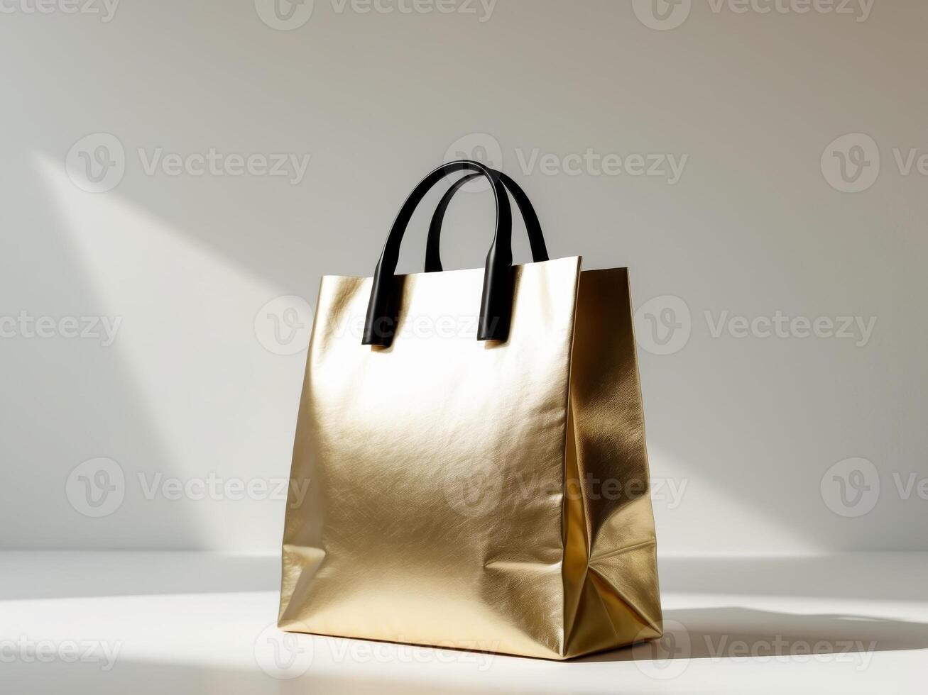 Golden shopping bag on white surface photo