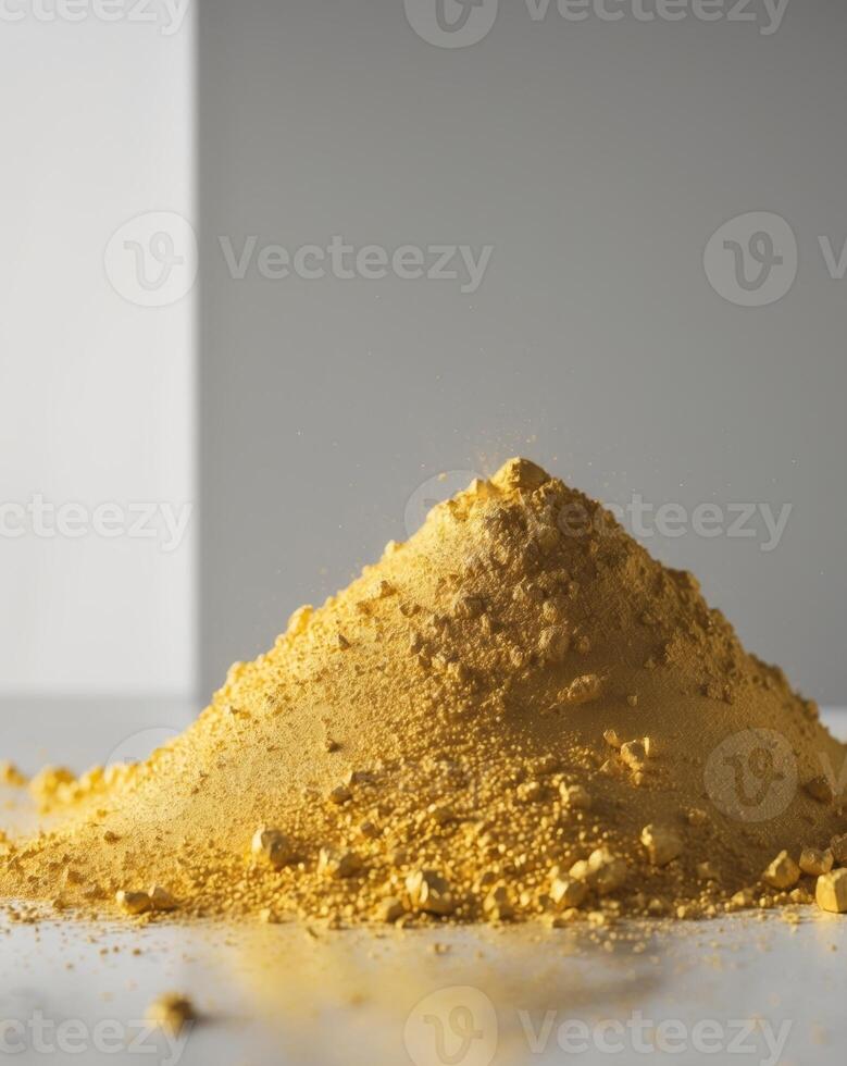 Gold Powder A bright yellow gold fine pile of gold powder with a photo