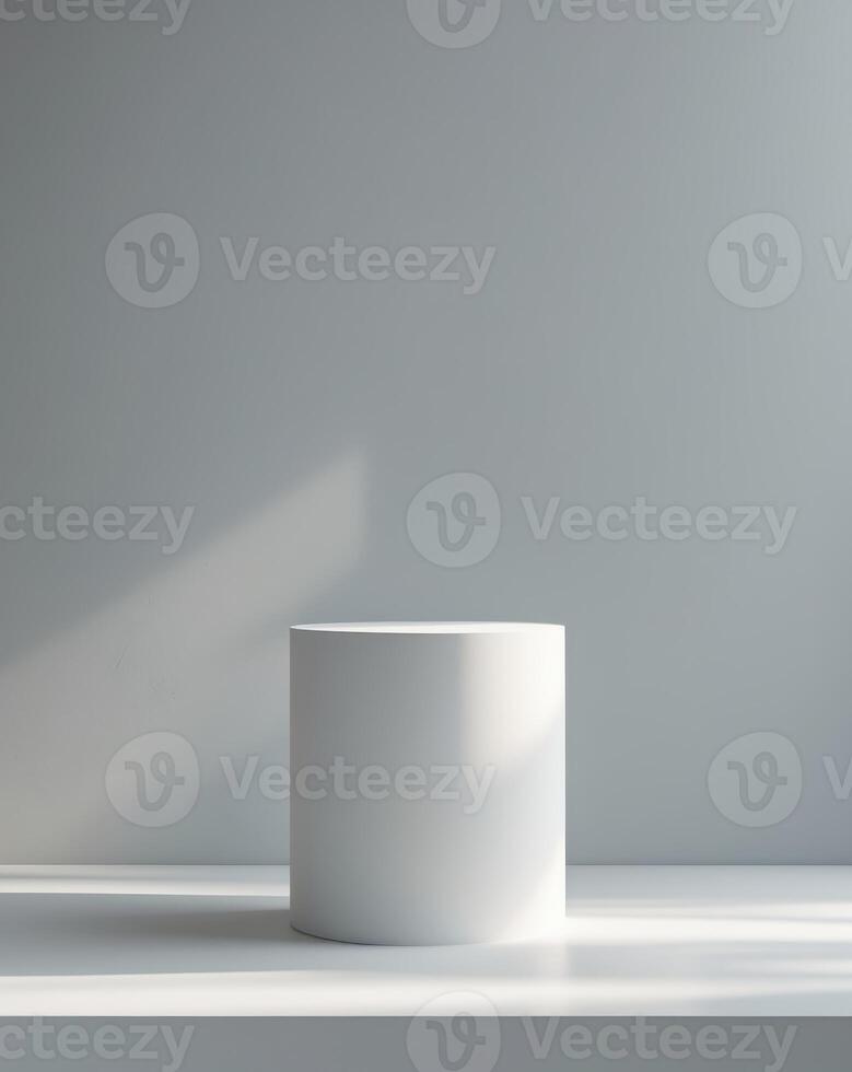 a white pedestal on a gray background with a light photo