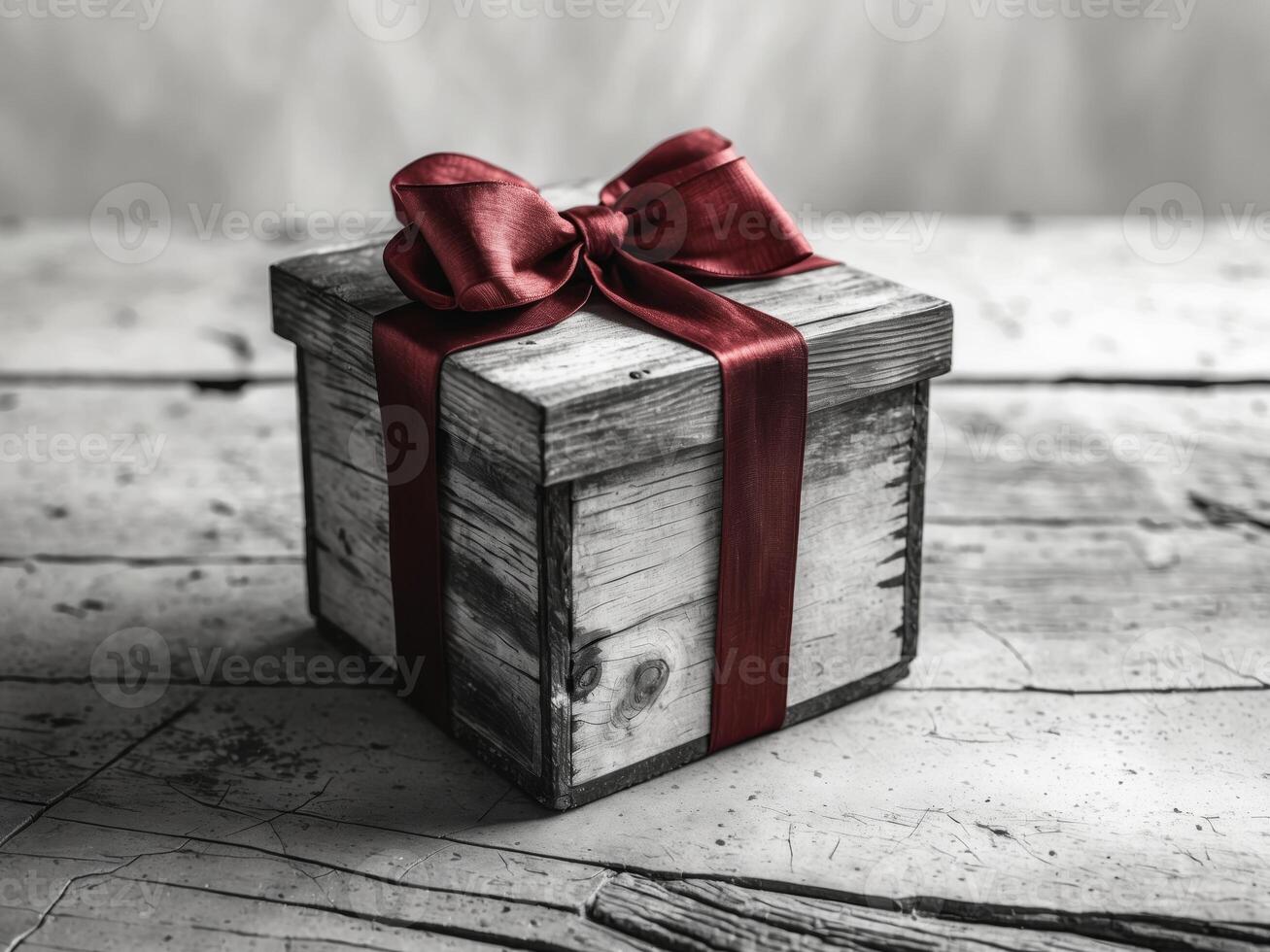 A wooden box with a red ribbon on top photo