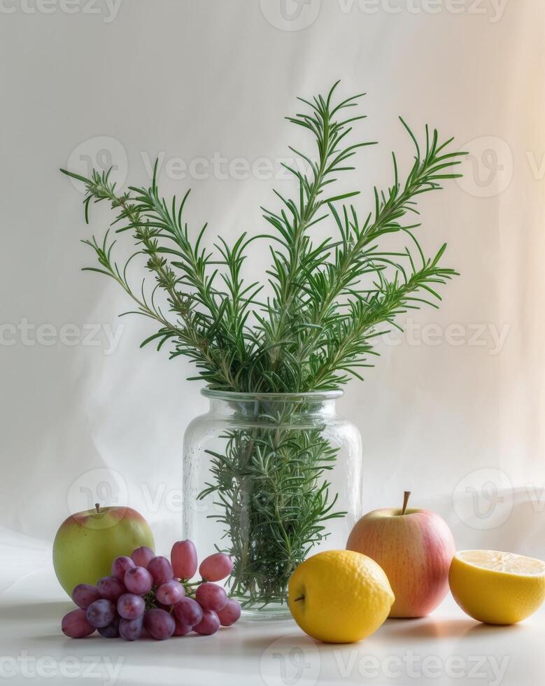 Still life with rosemary, grapes, and lemons photo
