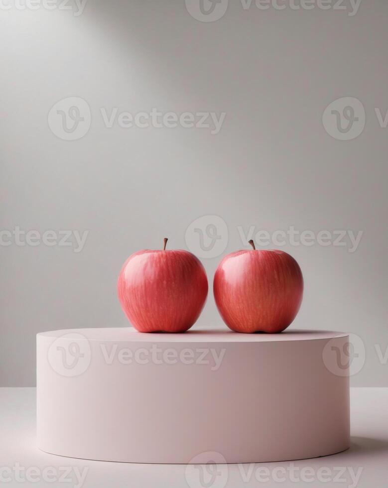 Two apples on a white pedestal photo