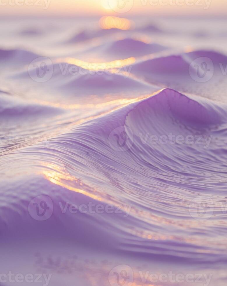 A purple wave in the ocean at sunset photo