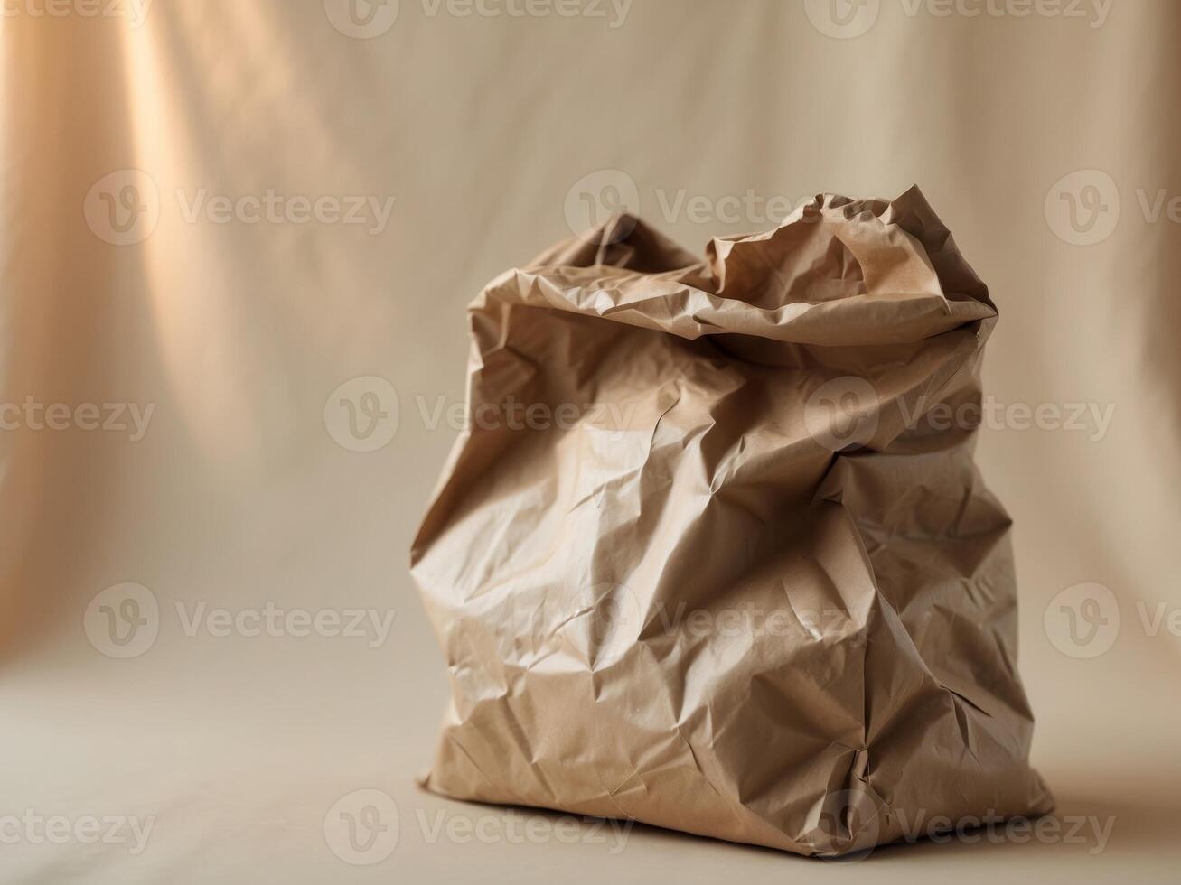 A brown paper bag sitting on a beige background photo