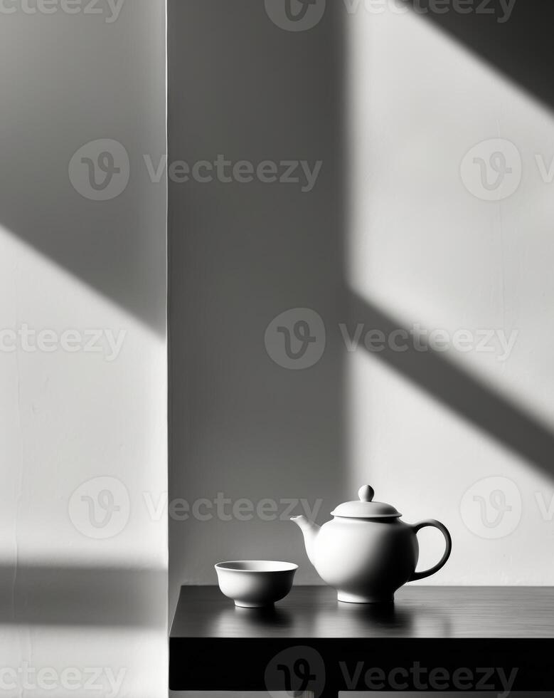 there is a tea pot and cup on a table next to a window photo