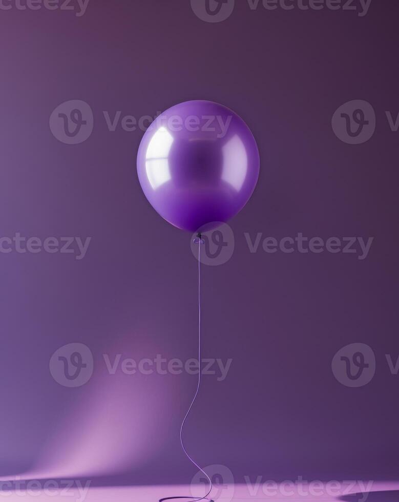 purple balloon with a string on a purple background photo