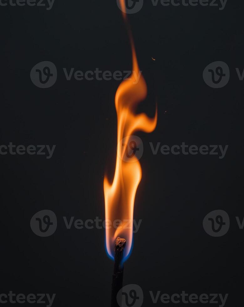 A lit matchstick with flames on it photo