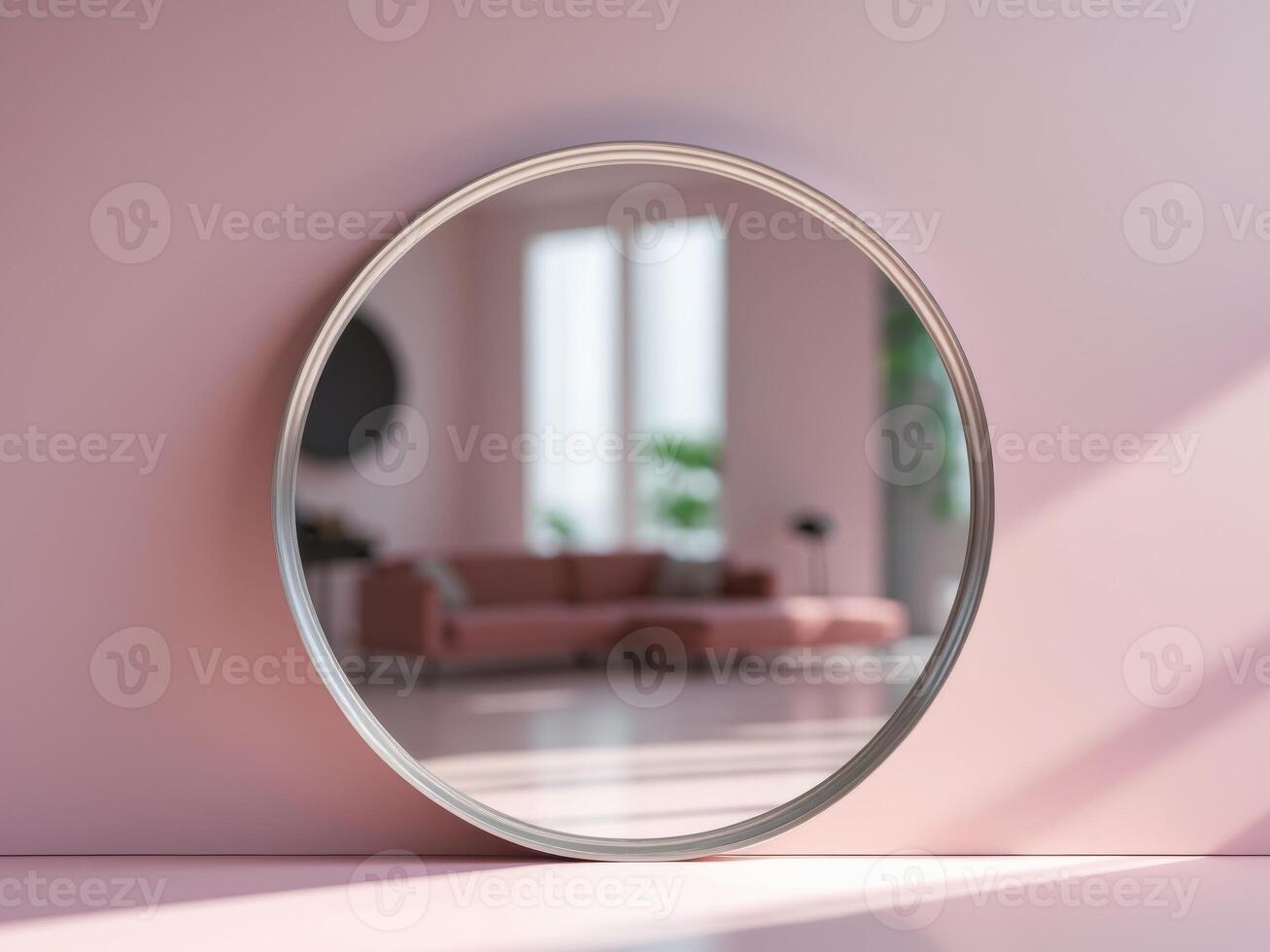 A round mirror is on a pink wall photo