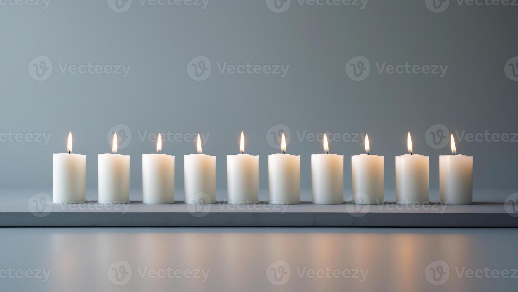 A row of white candles on a table photo