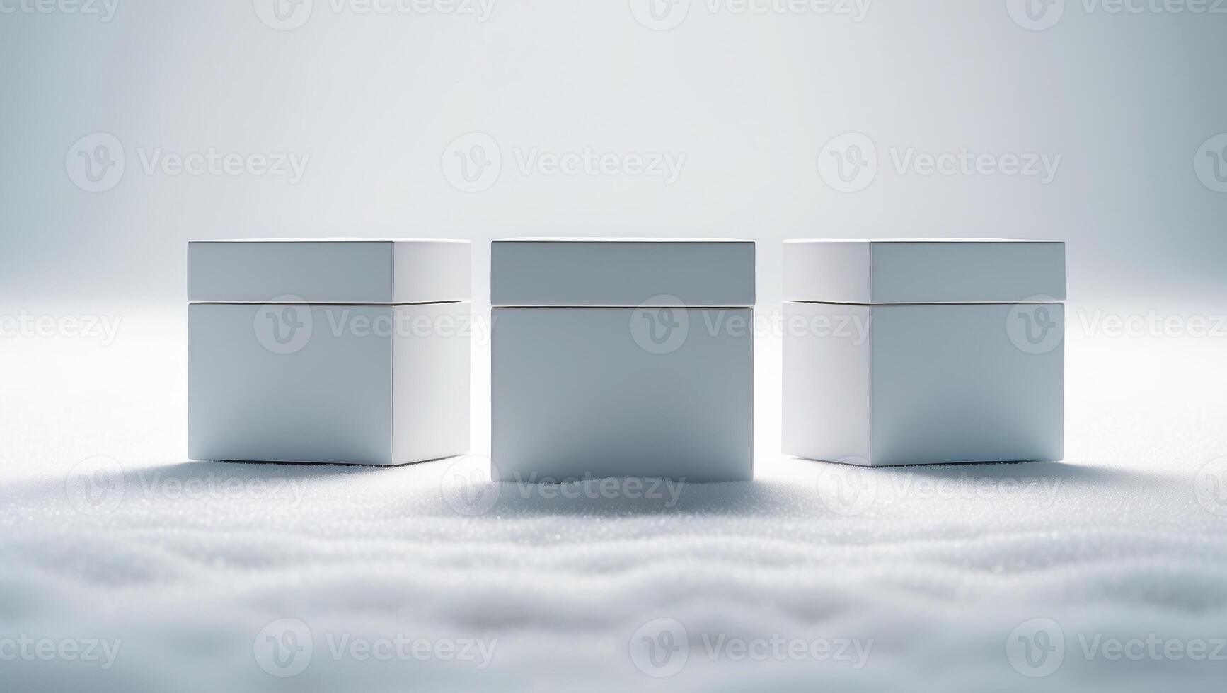 Three white boxes sitting on top of snow photo