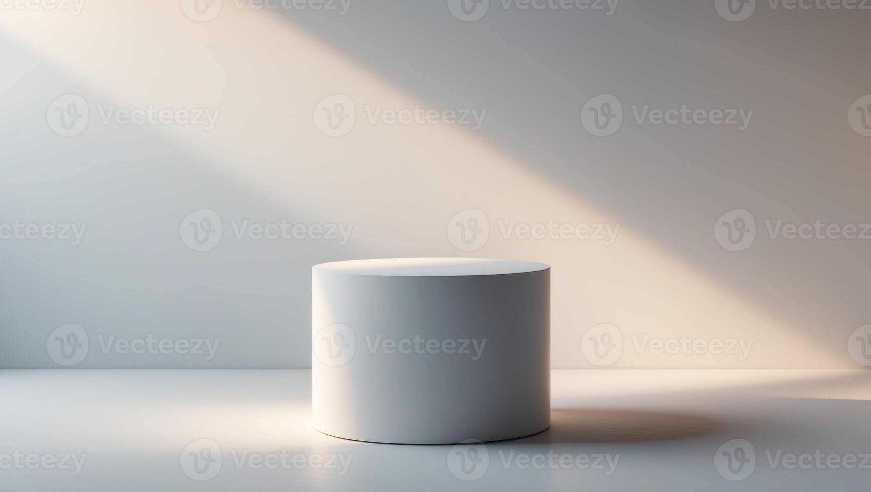 A white cylinder on a table in front of a wall photo
