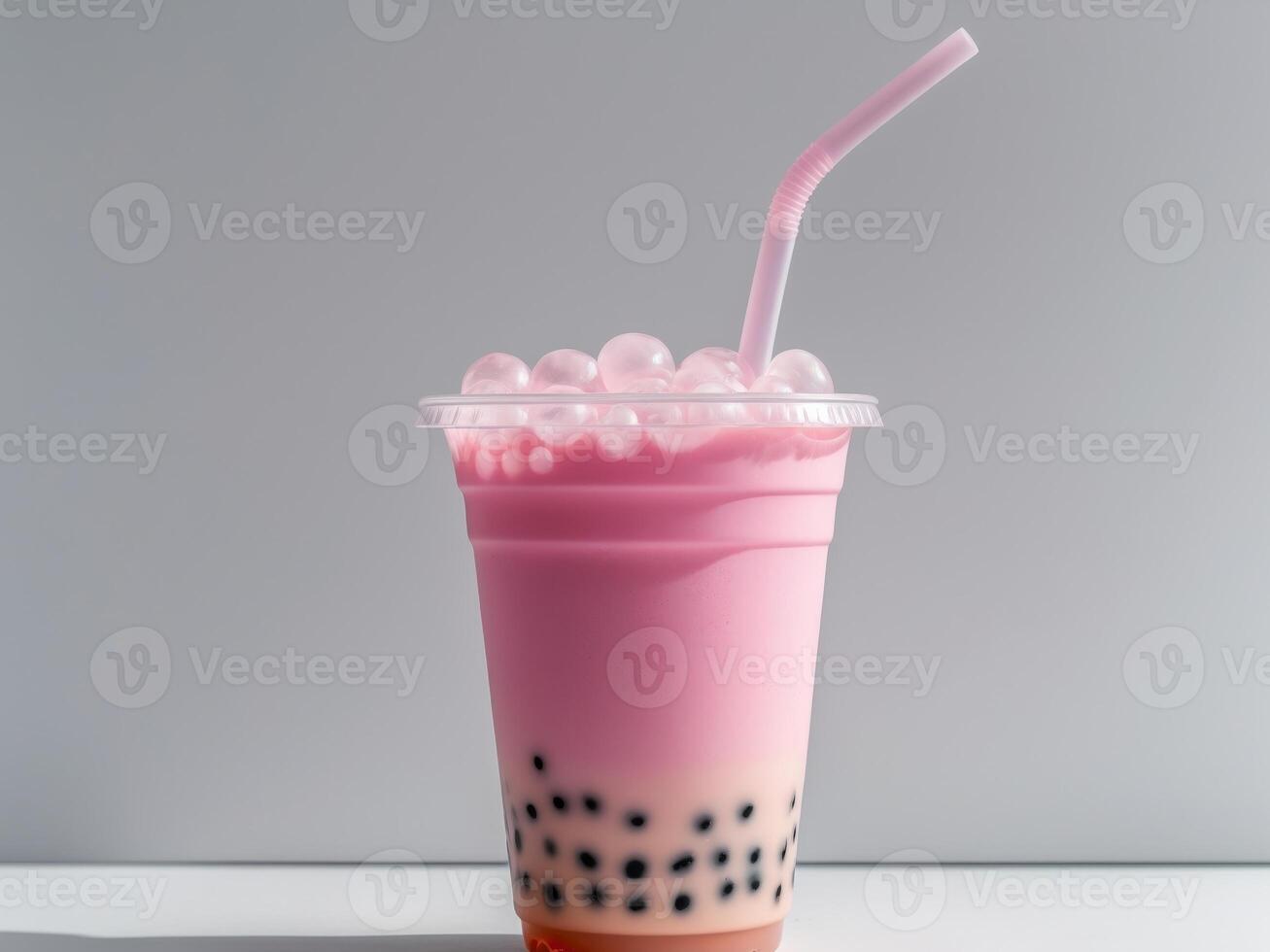 Bubble tea with pink drink in a plastic cup photo