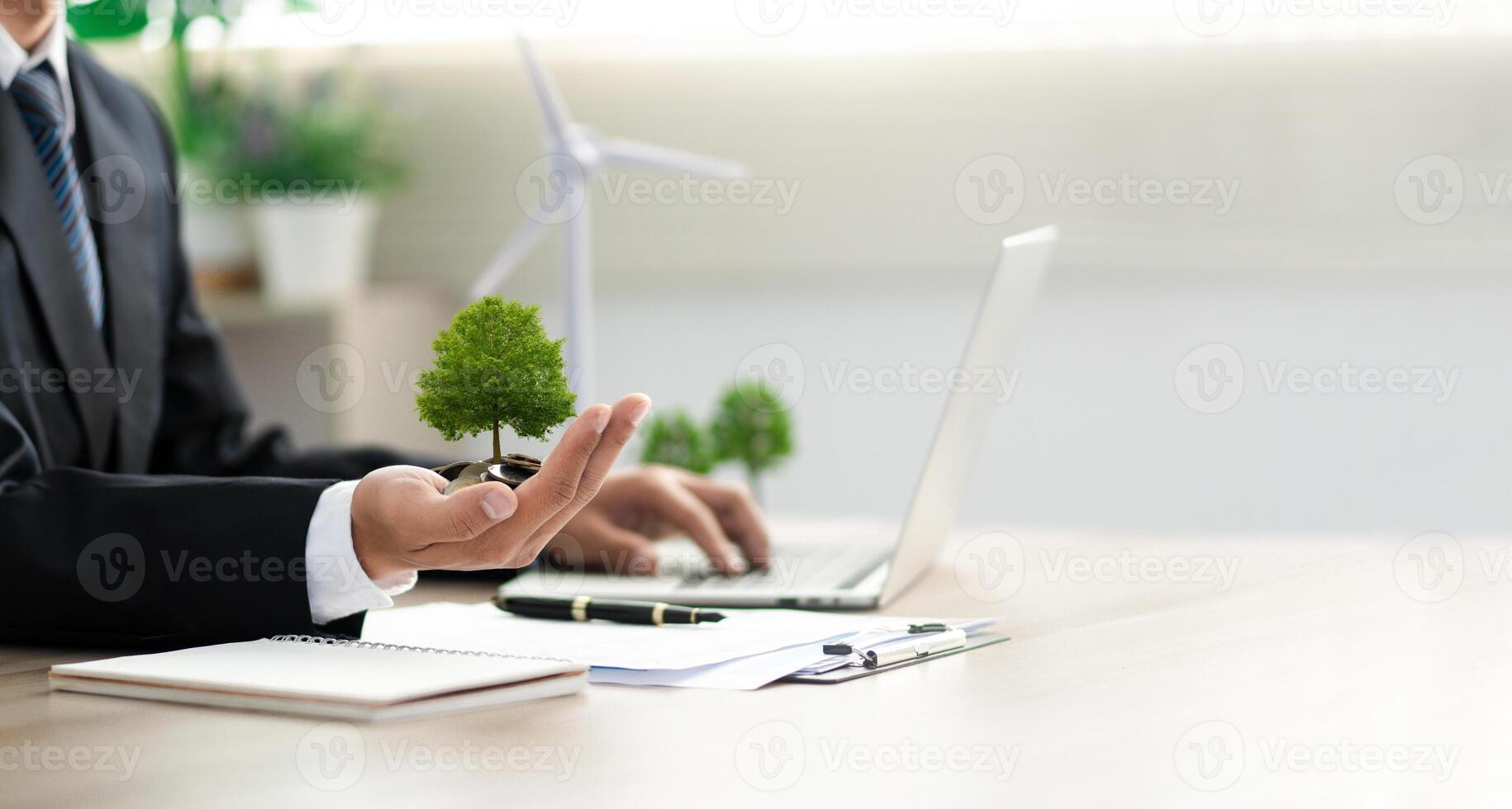 Businessman holding a green tree with esg icon. Concept of esg, environmental, social and governance responsibility. sustainable development green business photo