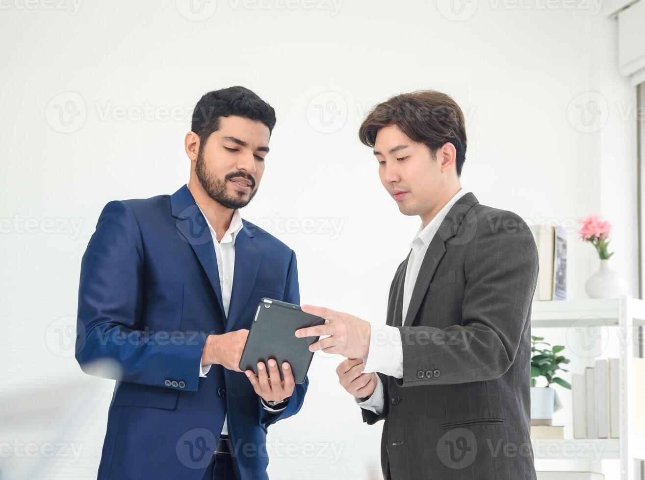 Portrait man business team Asian group meeting standting on wall wtite looking hand holding laptop and notebook ready for happy working online sale creative inside home office wall white backgroud photo