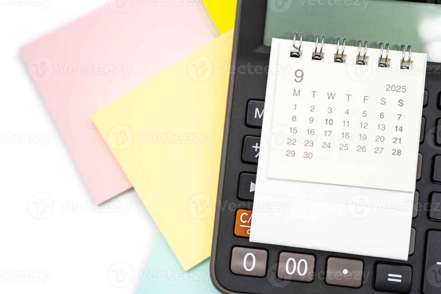Simple desk calendar for SEPTEMBER 2025 on calculator. Calendar concept with copy space. 2025 SEP calendar. photo