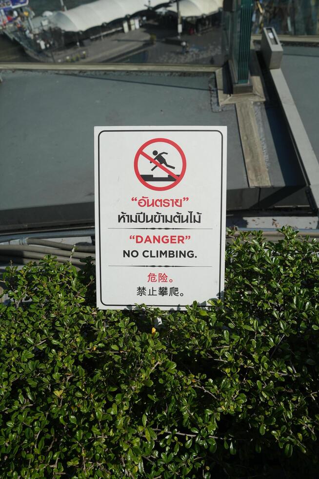 Bangkok, Thailand, 2024 - No Climbing sign in 3 Languages, English, Thai, and Chinese. All languages said the same as English photo