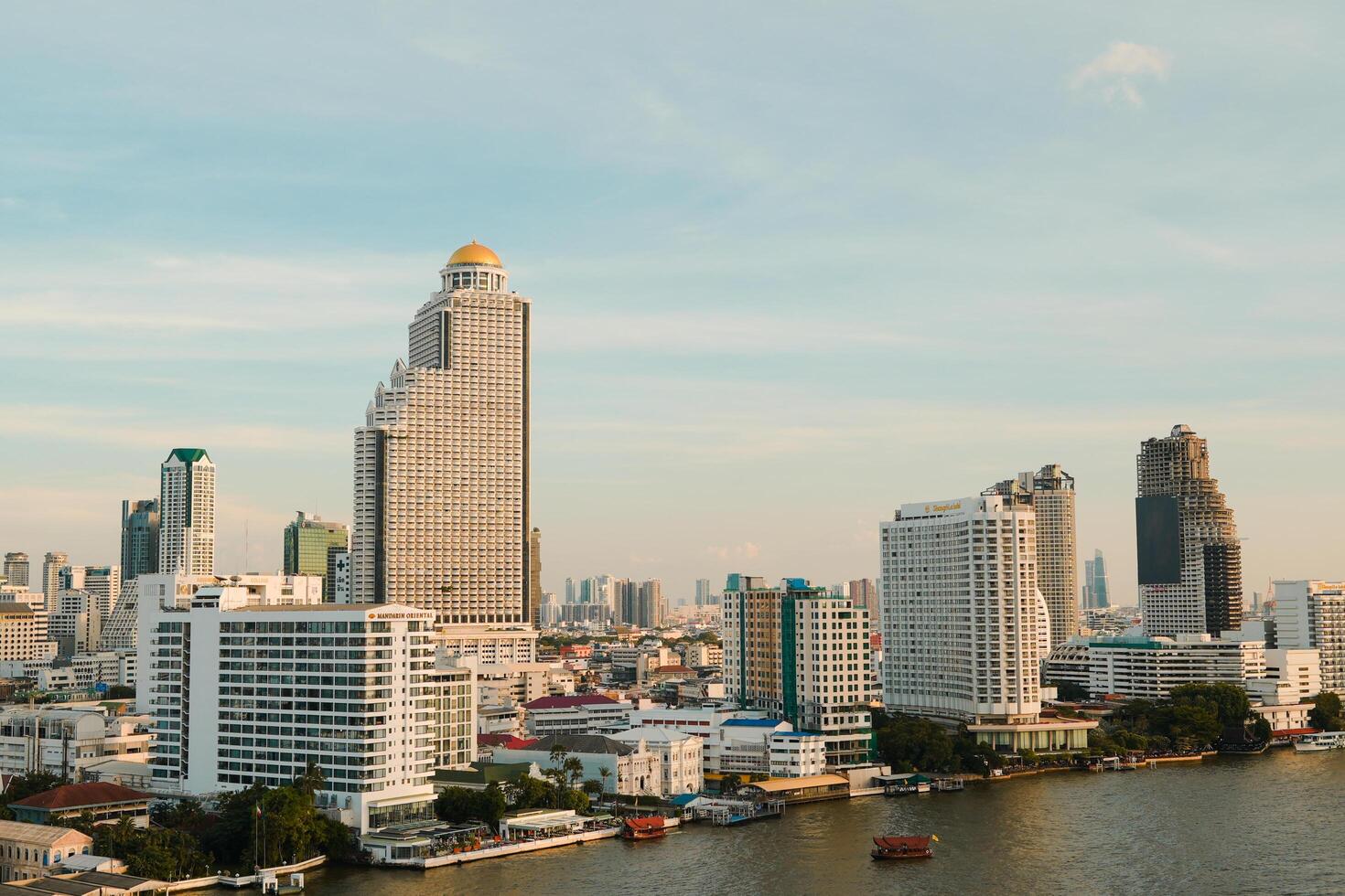 Bangkok, Thailand, 2024 - view to Sathorn and Silom from viewpoint of Iconsiam Shopping Mall at Chao Phraya River in Thonburi of Bangkok in Thailand. photo