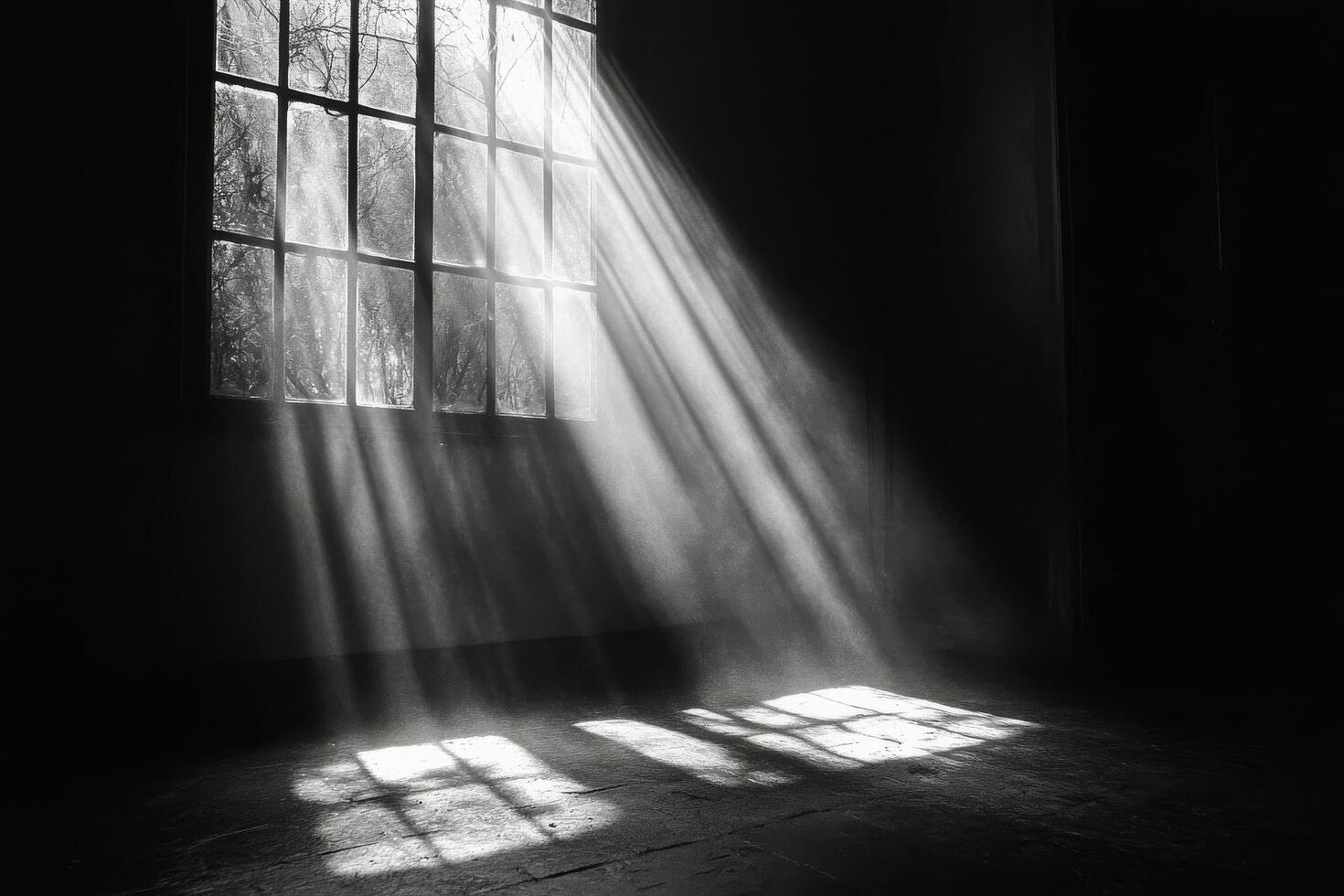 Light beams breaking through a dusty window in a dark, empty room during the late afternoon photo
