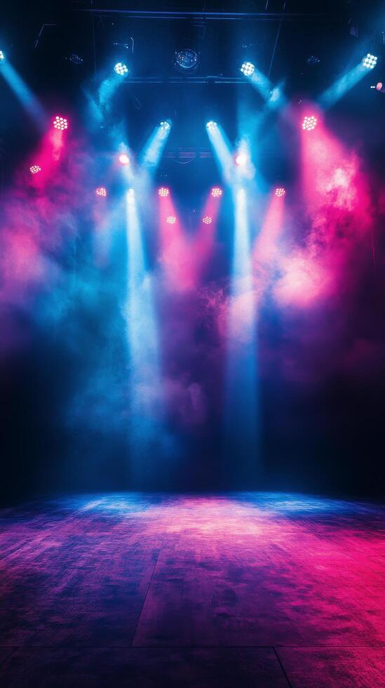 Bright stage lights illuminating colorful smoke during a live music performance at night photo