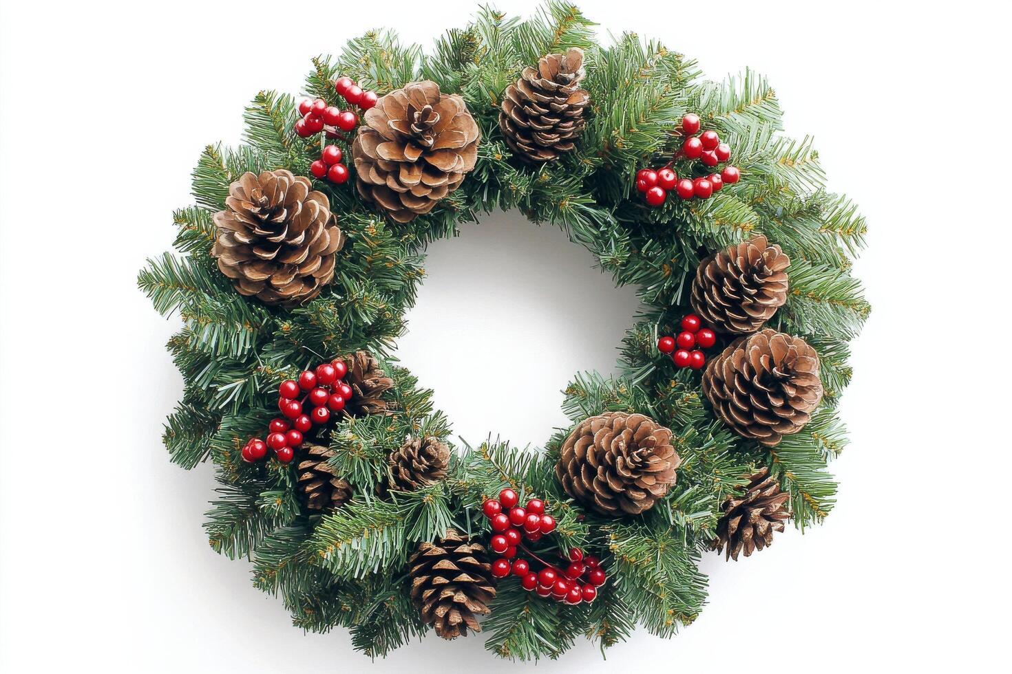 Holiday wreath decorated with pinecones and berries on white background photo