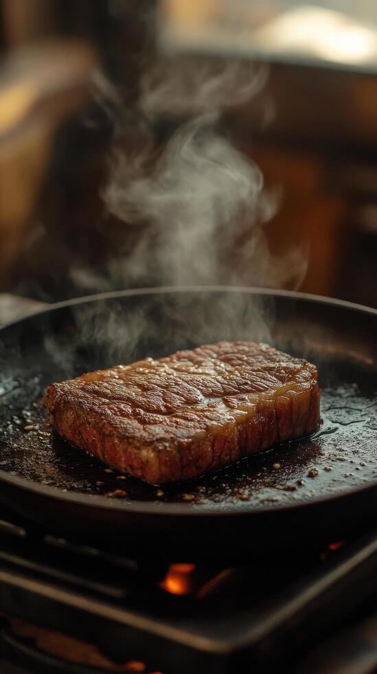Grilling tender beef steaks to perfection in a kitchen on a smoky evening photo