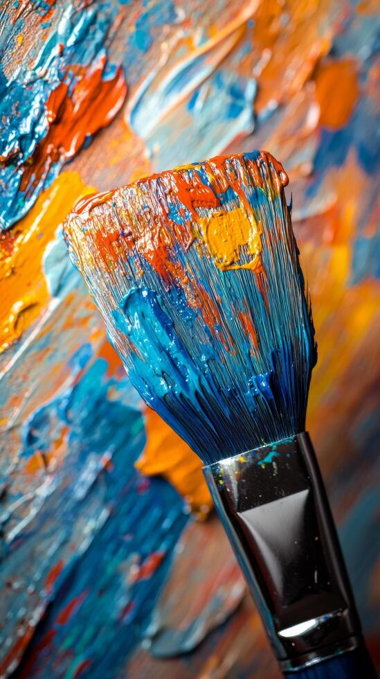 Vibrant brush resting on colorful paint palette showcasing artistic creativity and texture photo