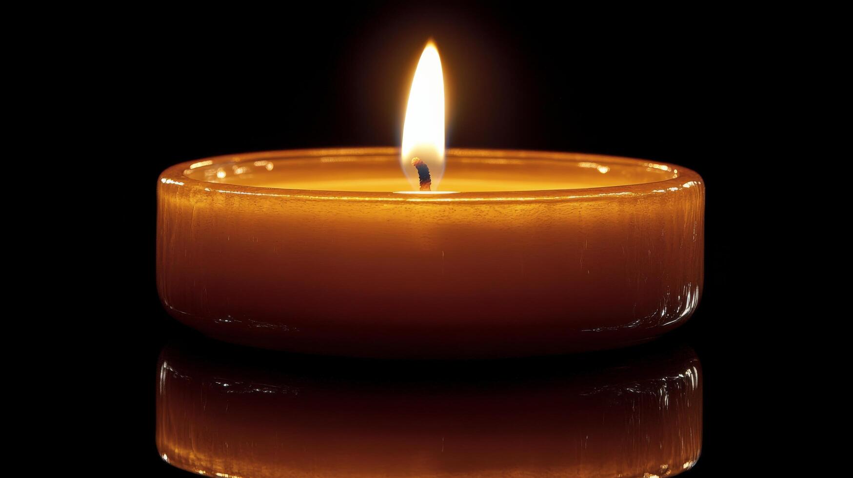 Warm glow of a candle illuminating a dark space with soft bokeh background photo