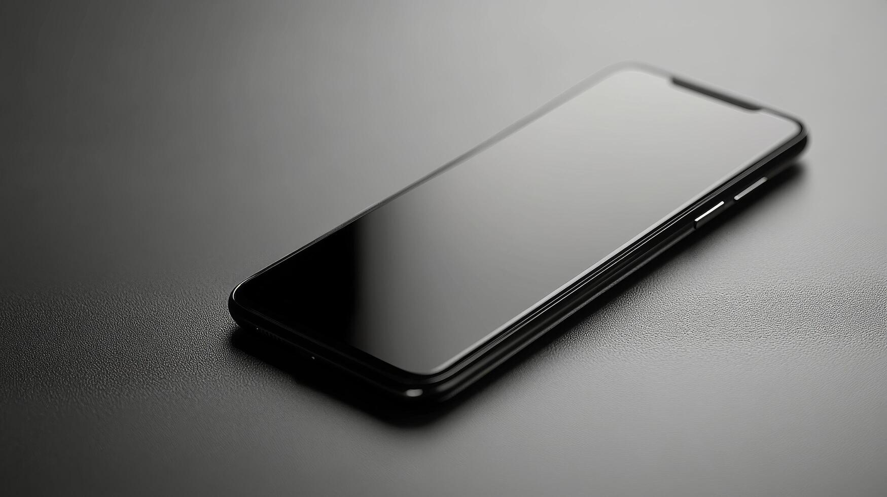 Modern smartphone resting elegantly on a textured display with decorative stones photo