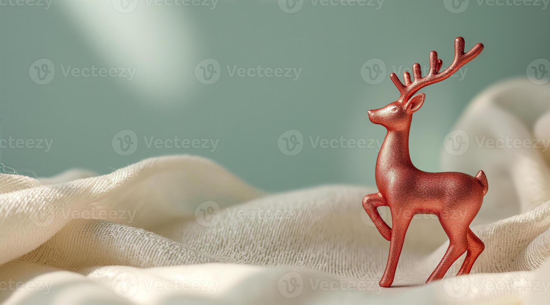 copper deer figurine on creamy textile photo