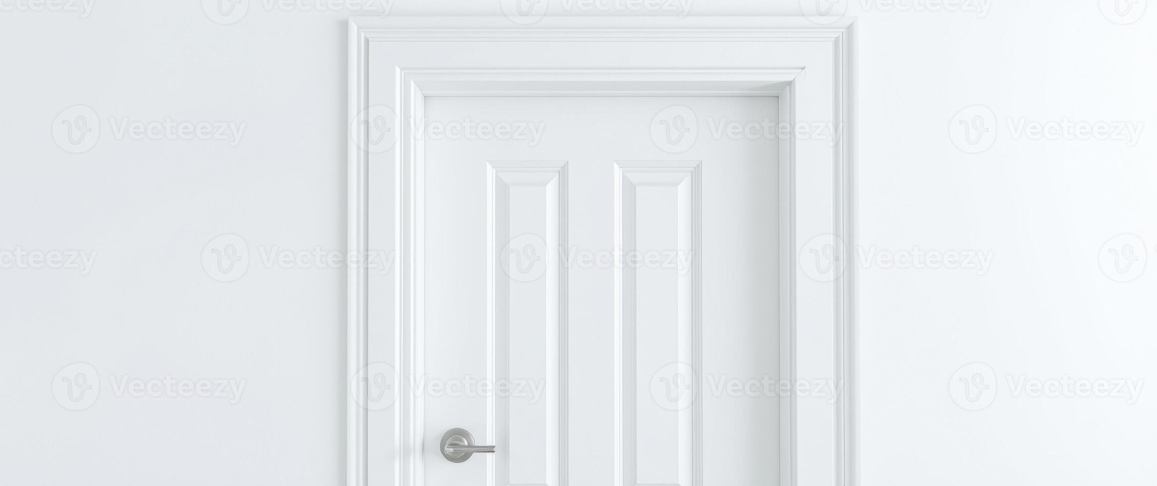 pristine white door with an ornamented frame stands against a white wall. photo