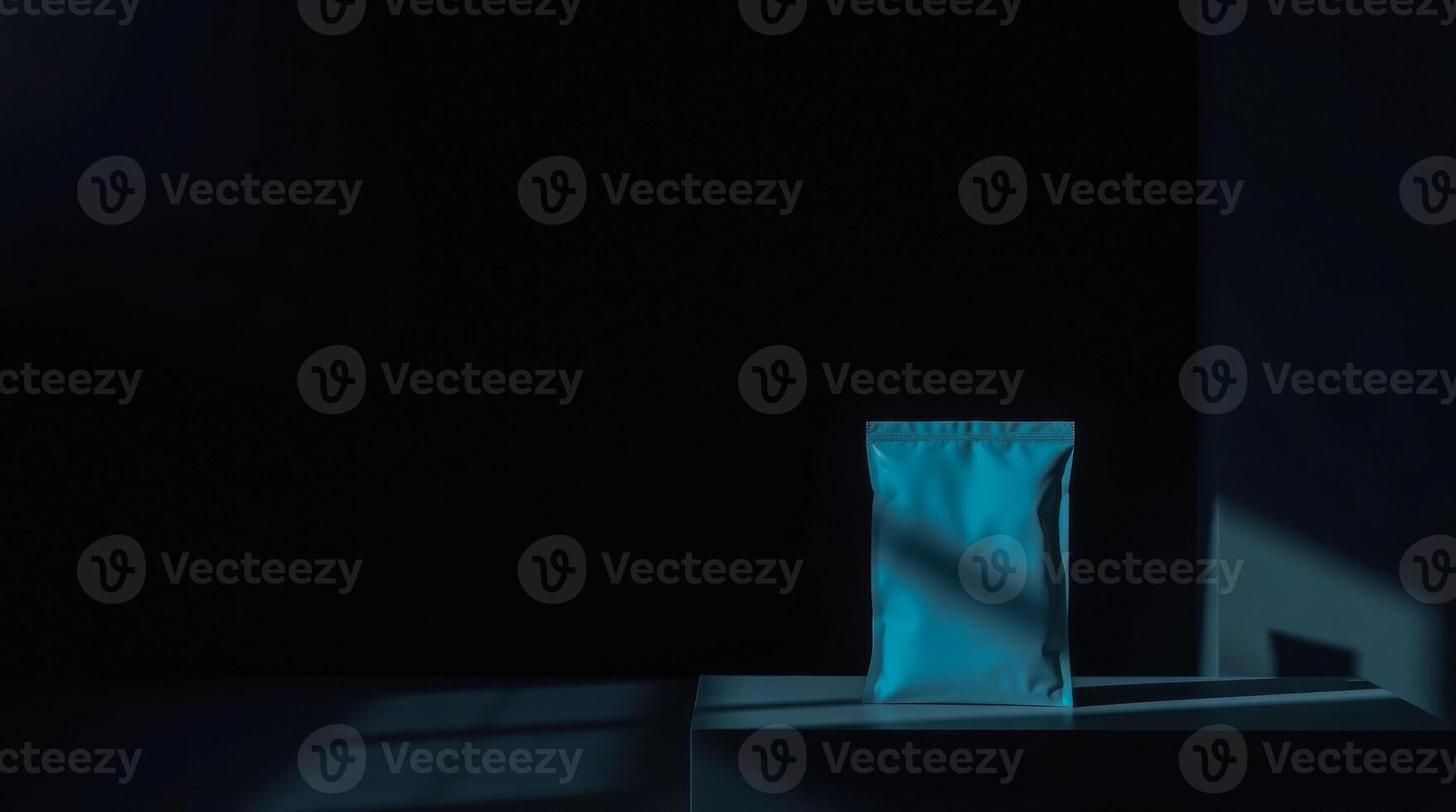 teal pouch on a dark platform photo