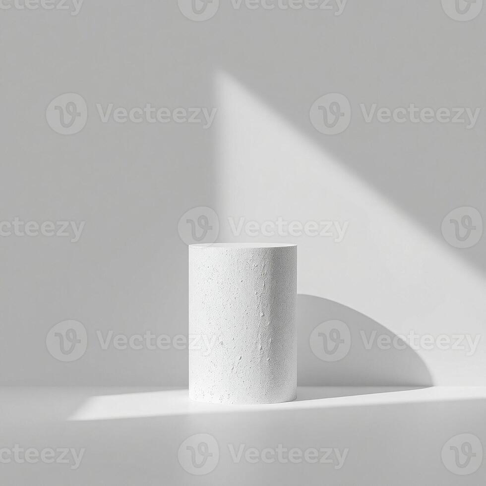 white textured cylinder pedestal a minimalist setting photo