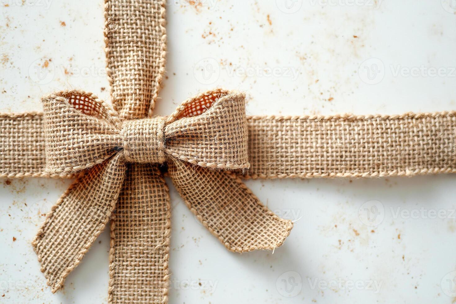 rustic burlap bow on surface photo