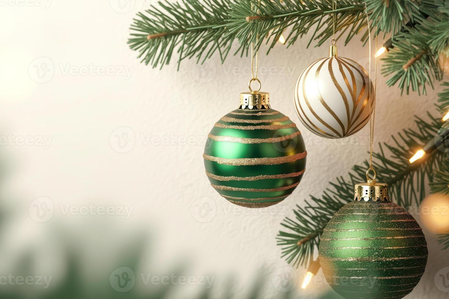 three decorative spheres hang from a conifer branch. photo