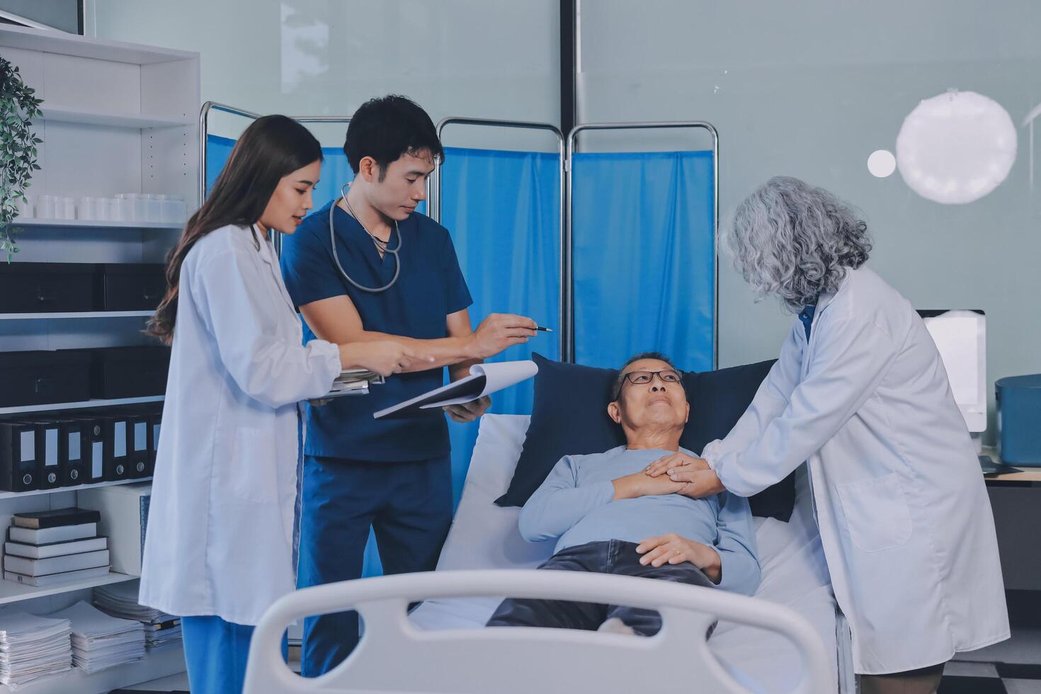 A team of doctors and nurses are working to treat a female patient in the patient's room. photo