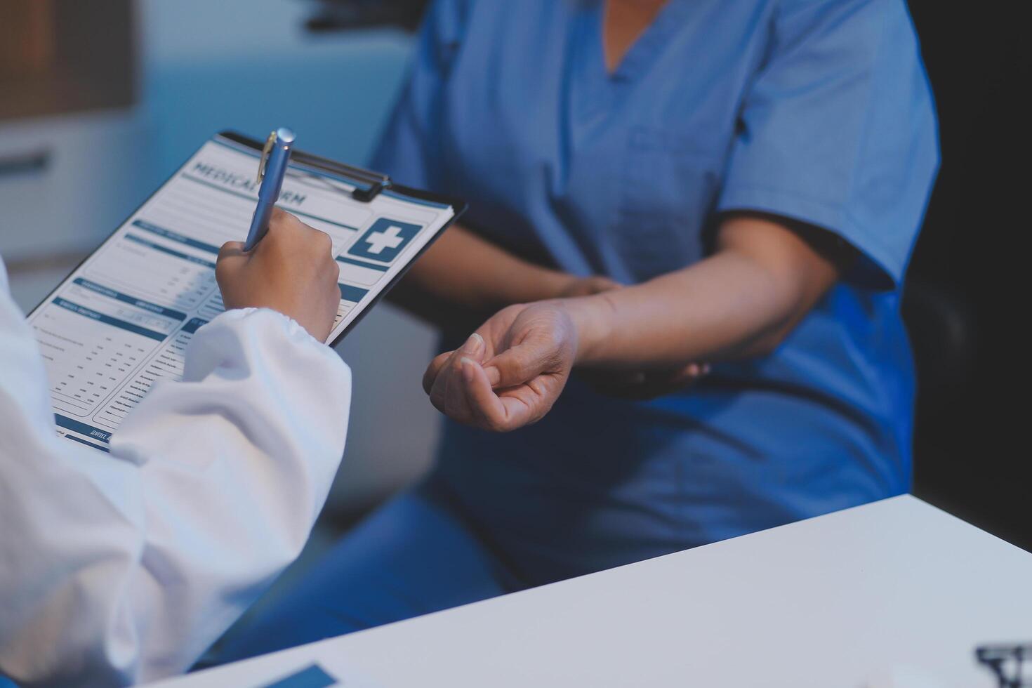Charming female doctor giving advice to a female patient. photo