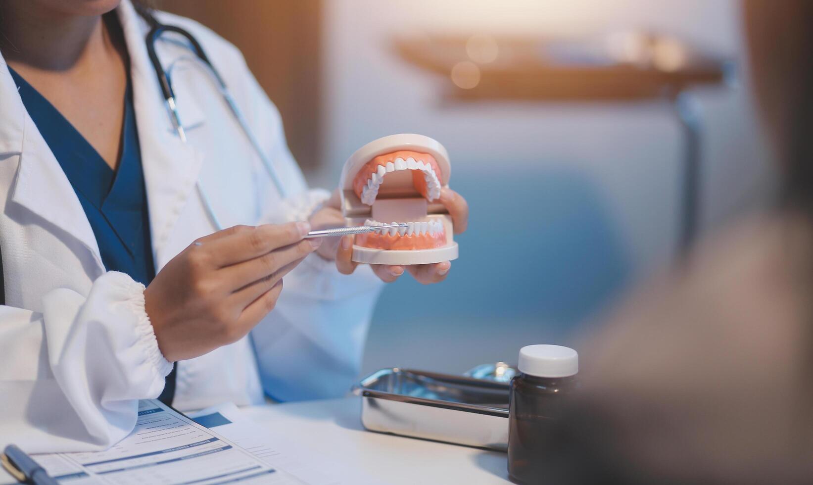 Dentist and patient discussion about planned dental treatment in dental clinic office, doctors talk and work. health care talk medical conference concept photo