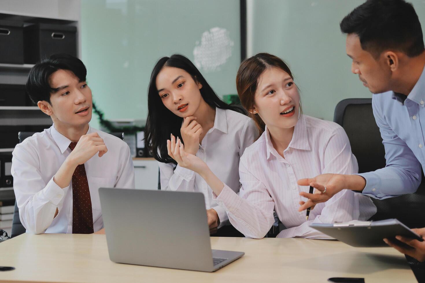Entrepreneurs and business people conference in modern meeting room, happy multiracial coworkers have fun cooperating working together at office meeting, asian teamwork concept photo