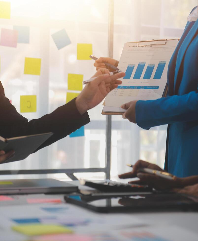 Meeting of business executives discussing analysis of the company's financial situation and business planning with partner collaboration and consultation of strategy. photo