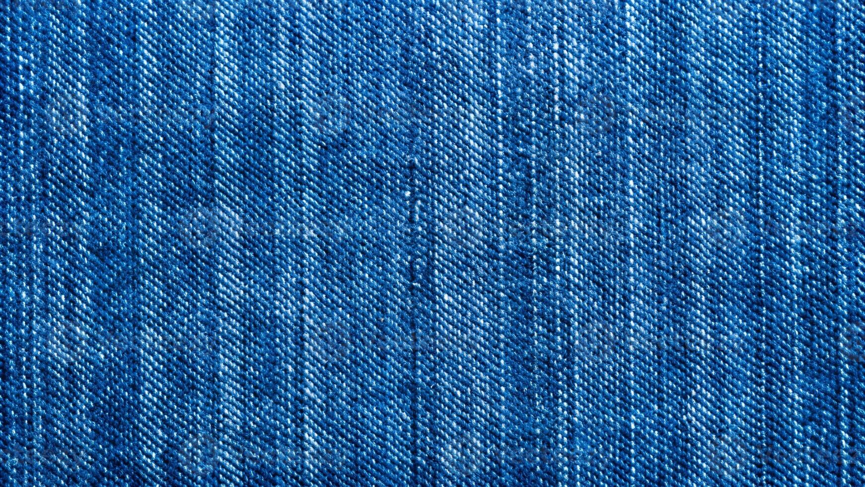 Classic Blue Denim Texture with Visible Weave and Subtle Variations photo