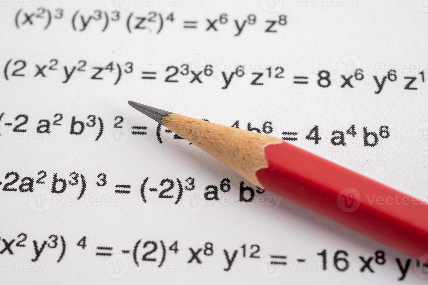 Pencil on mathematic formula exercise test paper in education school. photo