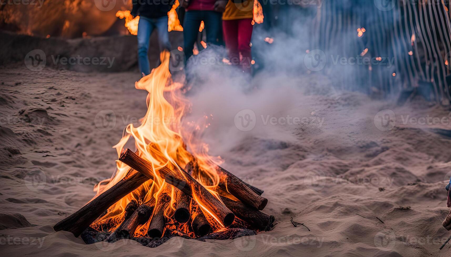Campfire with Smoke and Blurry People in the Background photo