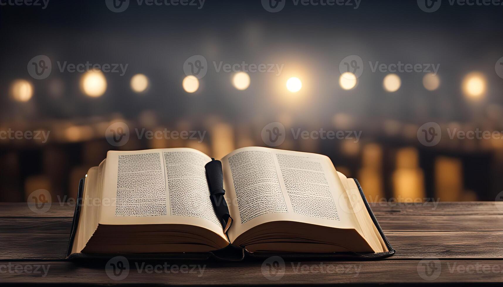 Open Book on Wooden Table with Blurry Lights photo