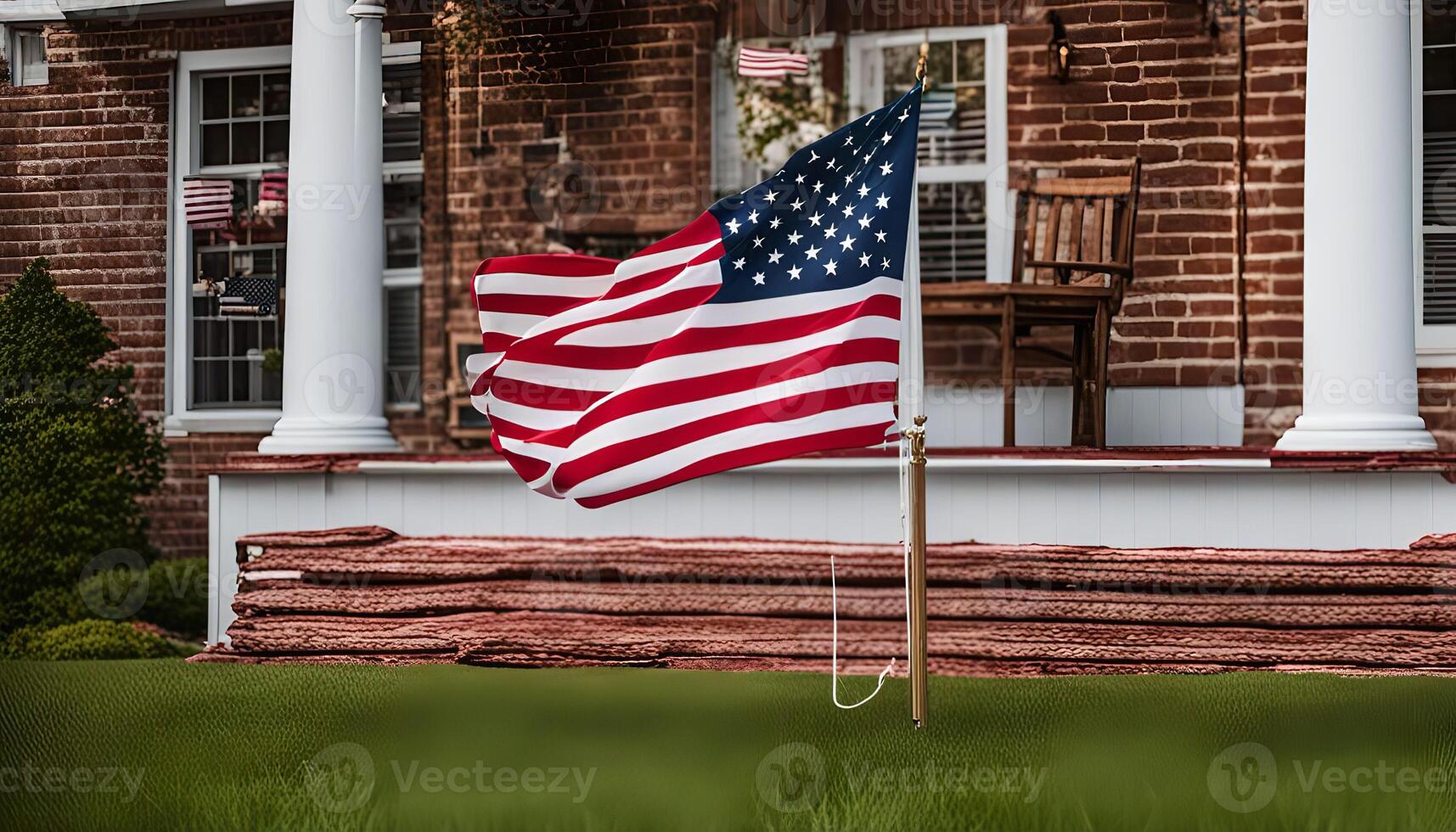 American Flag Waving in Front of a House photo