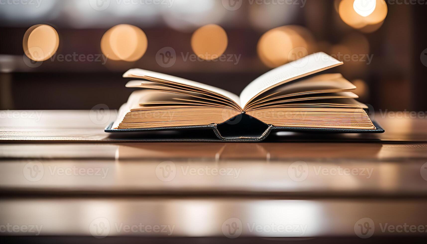 Open Book on Wooden Table photo