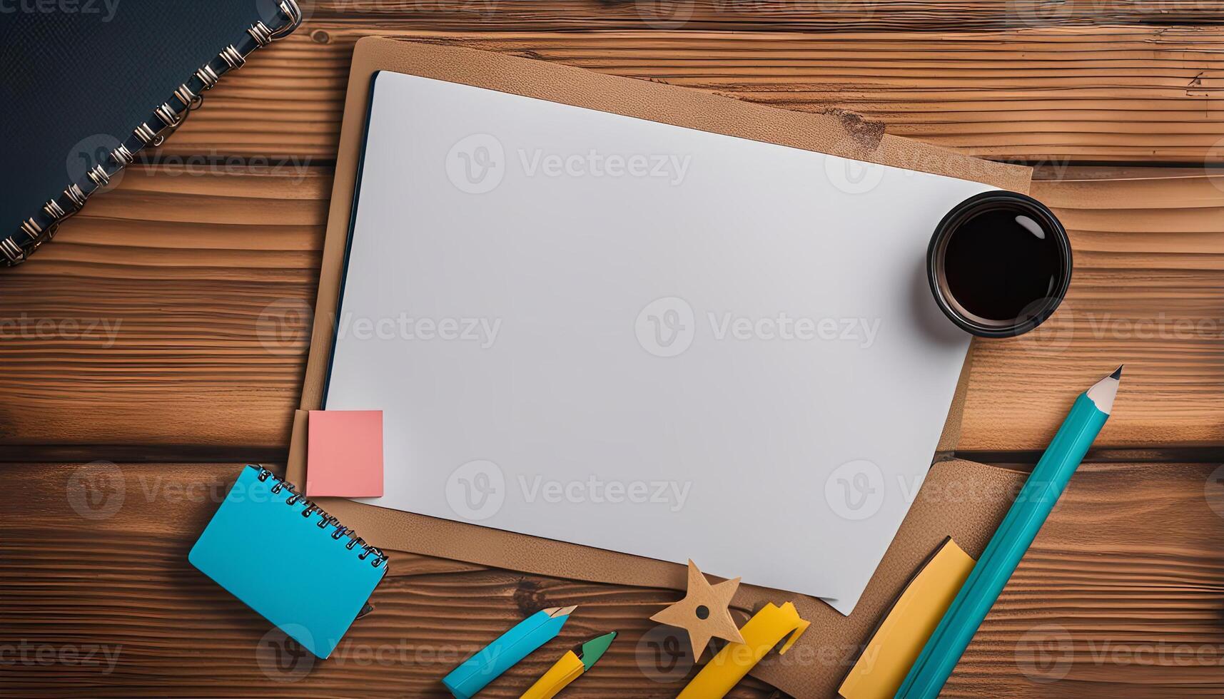 Blank Paper with Notebook and Pencil on a Wooden Table photo
